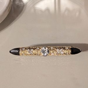 1928 Brand Rhinestones Set in Gold-toned Brooch w/ Black Enamel
